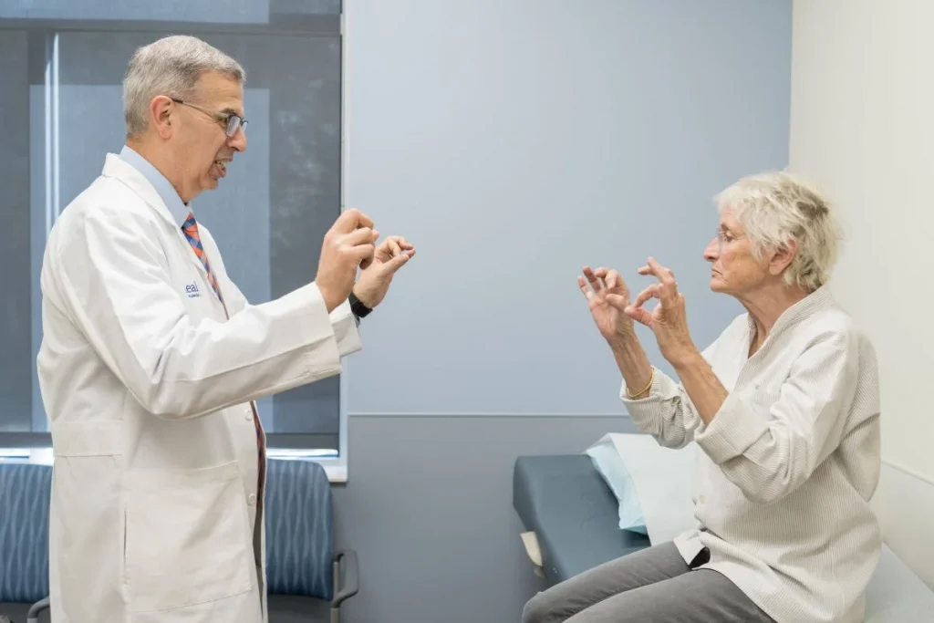 Doctor and patient doing hand exercise