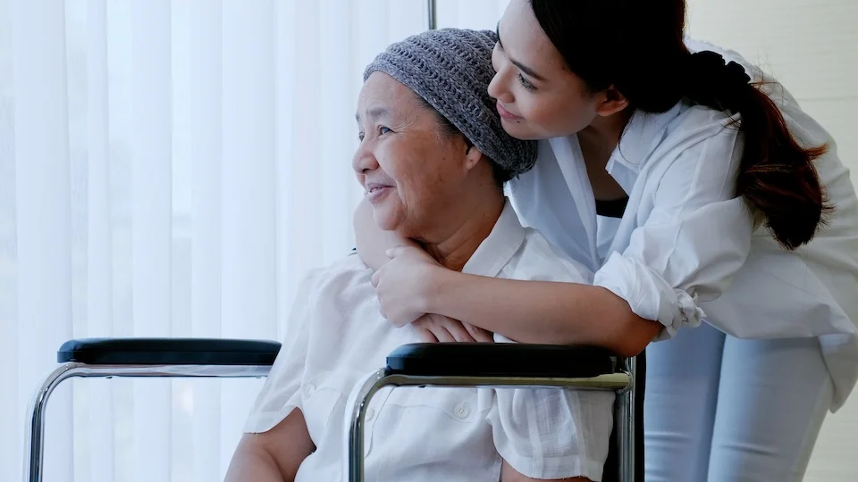 A cancer patient receives a hug